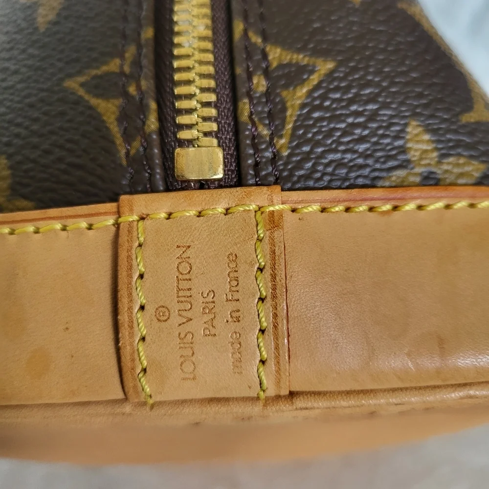 Authentic Louis Vuitton Monogram Alma PM Hand Bag..